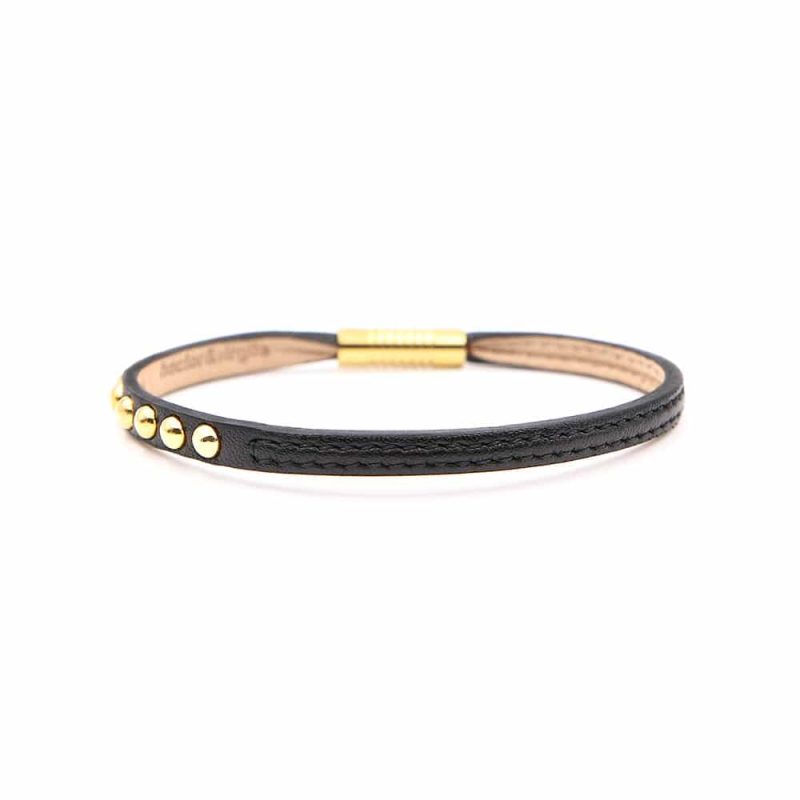 Bracelet en cuir artisanal pour femme Sirli avec un design à la fois classique et original. Made in France, haut de gamme. Couleur noir et boucle dorée. Fabriqué en France.