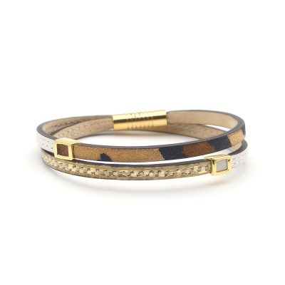 Bracelet en cuir artisanal Arlequin avec un design classique et original. Couleur panthère, blanc et or pailleté. Accessoire de luxe fabriqué en France.